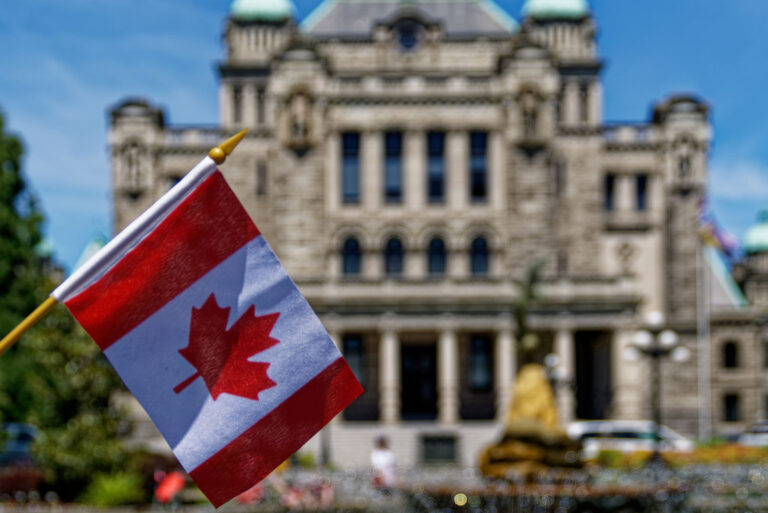 Canadian flag in front of a government building